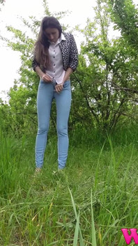 Skinny Brunette Just Had a Pee in the Tall Grass and Now She Puts on Her Jeans and Shoes