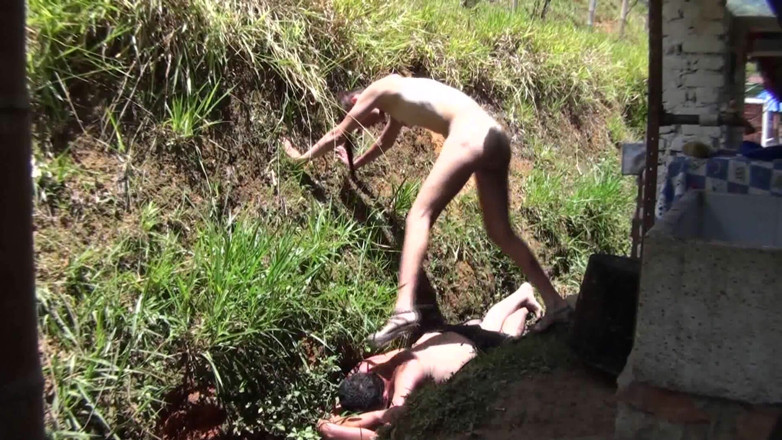 Femdom Austria: Nude babe stomping her slave in the backyard