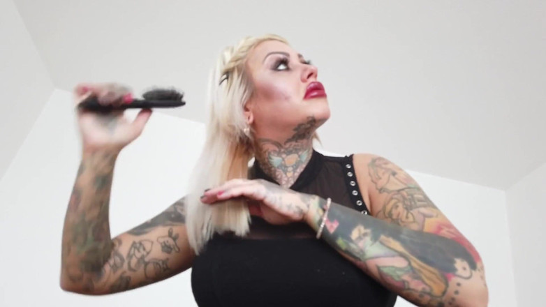 Fetish videos by Alex: Tattooed blonde MILF combing her hair.