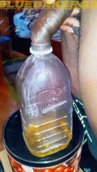Pissing in a Large Juice Container