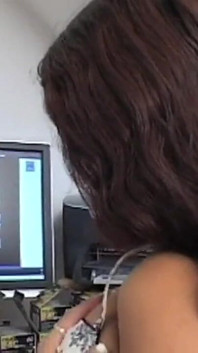 Horny brunette masturbates in the office with her sex toy