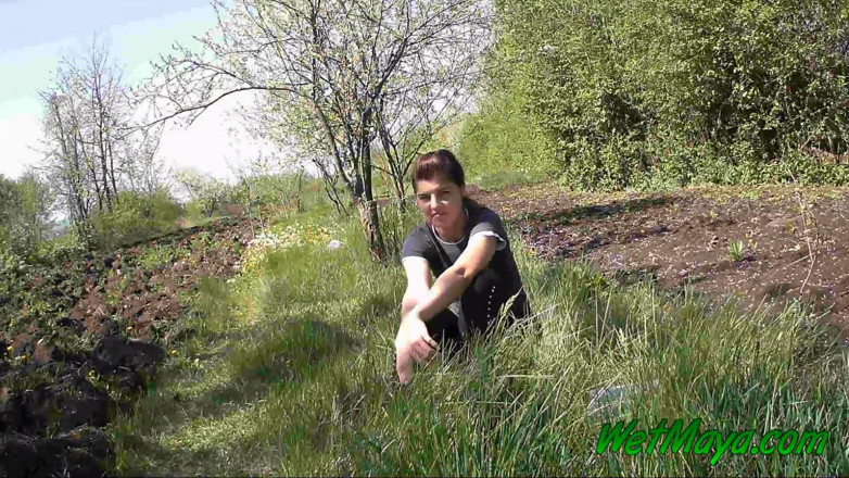 Wet Maya: Pissing in grass on the side of the road