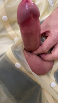 Putting a Condom on in Transparent Latex Raincoat