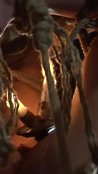 Witch Hangs Upside Down and Gets Drizzled with Black Wax