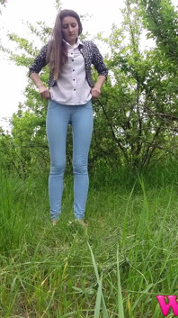Skinny Brunette Just Had a Pee in the Tall Grass and Now She Puts on Her Jeans and Shoes