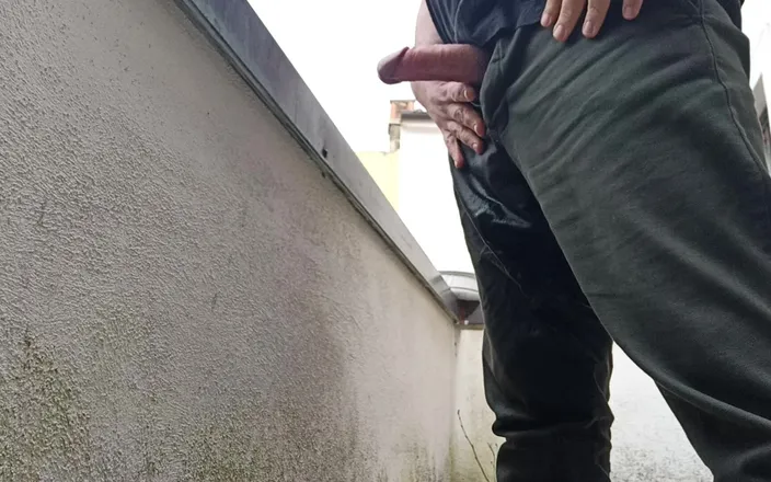 Kinky Guy: Peeing on the Balcony While Watching People Outside
