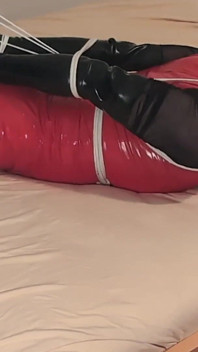 Hot Blonde in Hogtie, Long Latex Gloves, Red Pvc Dress and Stockings Let to Struggle to Get Free.