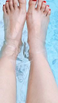 The Mistress Soaked Her Beautiful Feet in the Swimming Pool.