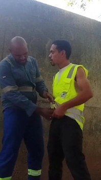 Two Workers Behind the Service Wall