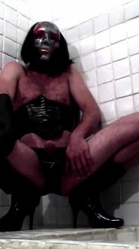 Latex Masked Sissy in Corset Cums in the Bathroom