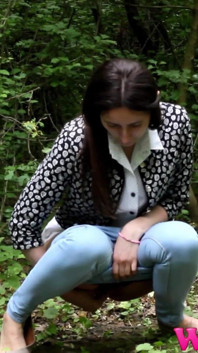 Skinny Brunette Desperate to Pee in the Woods Has to Find a Way to Empty Her Bladder