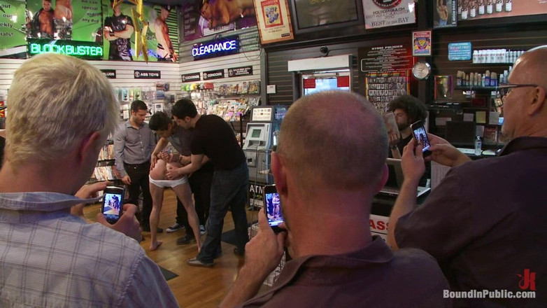 Bound in public: Innocent man is taken into a porn shop and turned...