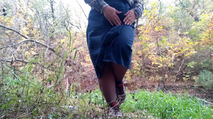 Elena: MILF pissing in a park