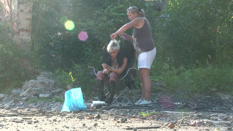 Public Entertainment: Blonde babe gets her hair done outdoors