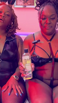 Behind the Scenes: Temptress Mango and Golden Goddess Prepare for a Sultry Fetish Video Shoot