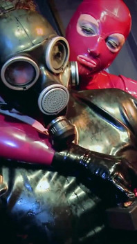Femdoms wearing latex pegging slave and seducing his cock
