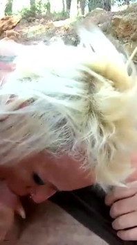 Slut with big tits loves sucking two cocks at once