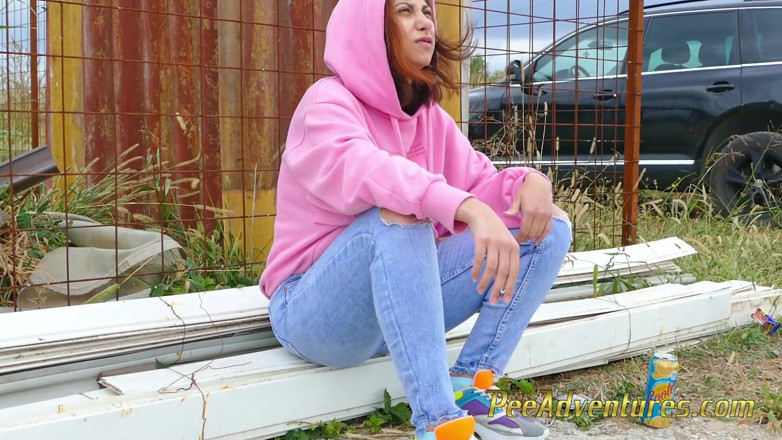 Pee Adventures: Girl with a hoodie pee trough her jeans