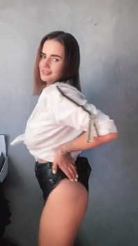 A Brunette in a White Shirt Is Ready to Bare Her Big Breasts