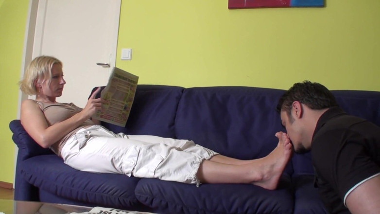 Foot Girls: Feet smelling while reading the newspaper