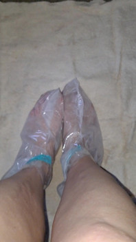 Pedicure Step Feet in Plastic Foot Mask Booties