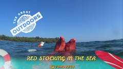 Red Stocking in the Sea at the Outdoor Beach
