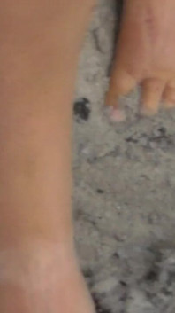 Jen Shows up Her Naked Feet in the Sand