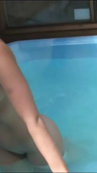 Very Beautiful Sexy MILF with Big Tits Masturbates Her Pussy with a Dildo in the Pool