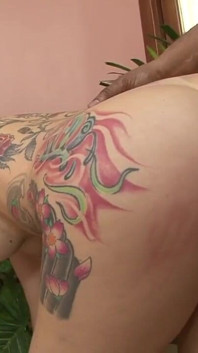 Body tattooed chick anally banged by a big black cock