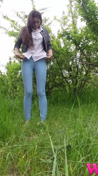 Skinny Brunette Just Had a Pee in the Tall Grass and Now She Puts on Her Jeans and Shoes
