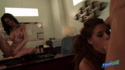 Gangbang Gone Wild: Muscular guy bangs hard two busty brunettes in the office