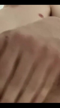 Masturbating