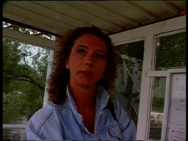 Lucky Cooch: Vintage brunette giving an interview outdoors