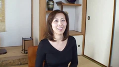 Brunette asian milf stripping and showing what she's got