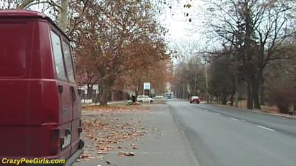 Crazy pee girls: Girl peeing between the cars