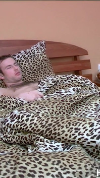Resting in Bed Dude Gets an Unexpected Handjob From a Blonde