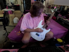 Liz Young playing guitar thumbnail