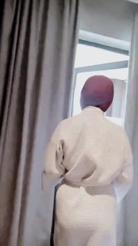 Hijab-wearing Woman Bathes Naked in an Open Swimming Pool