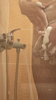 A Young Guy Washes in the Shower and Dreams of Someone Being Next to Him