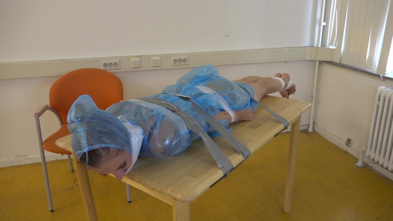Restricting Ropes: Taped to their work desk