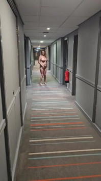 Naked in the Village Hotel Corridor