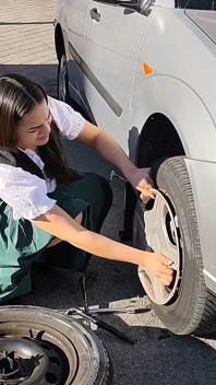 Dirndl Slut Gets Dirty and Oily Changing Tires