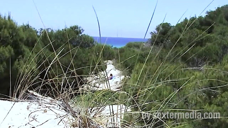 Sextermedia by Pete: Redhead beauty dildoing pussy on the sandy beach
