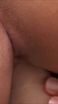 Amateur on the bed at home rubs her hairy pussy