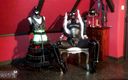 Dominatrix Frida: La dominatrice Frida en combinaison en latex - corset moulant - bottes...