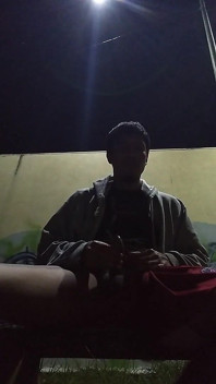 No Warm Shirt Man in Park with Only Sweater on Feeling Warm