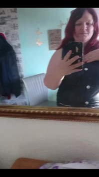 Showing off in a cool lab coat in front of the mirror