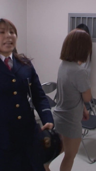 This Female Was by a Police Guard in the Prison Where She Was Held