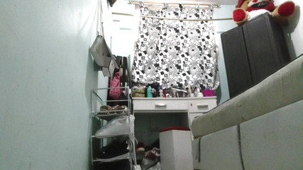 Katrina4deluxe: Nurse in her room after coming home from work