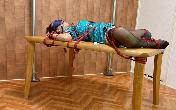 ushirosugatanomiki: A Woman Is Tied Down on a Table and Cannot...